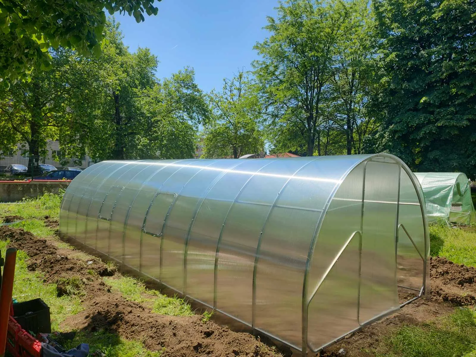 The same greenhouse frame enclosed with polycarbonate panels